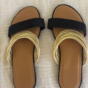 Chic Black and Gold Sandals with Minimalist Design